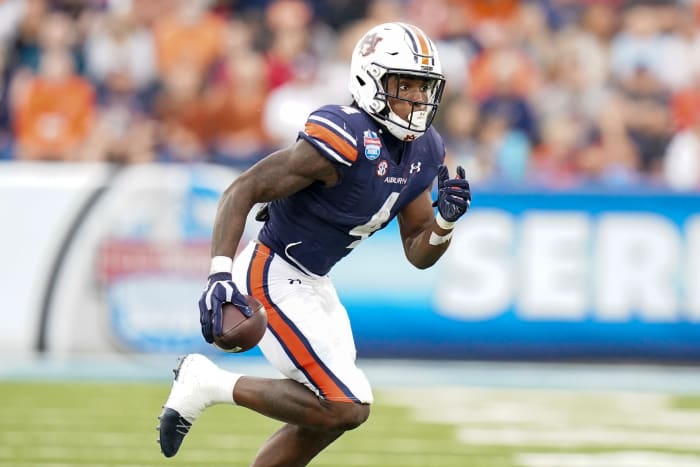 Dec 28, 2021; Birmingham, Alabama, USA; Auburn Tigers running back Tank Bigsby (4) carries the ball against Houston Cougars during the second half of the 2021 Birmingham Bowl at Protective Stadium. Mandatory Credit: Marvin Gentry-USA TODAY Sports